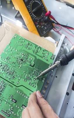 Technician repairing  a television.