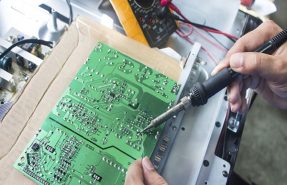 Technician repairing  a television.