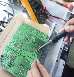 Technician repairing  a television.