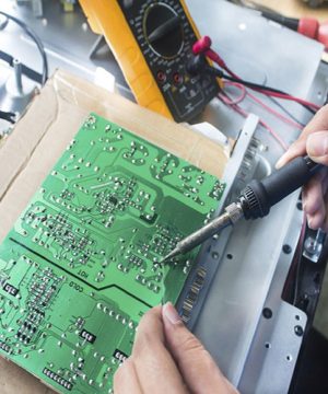 Technician repairing  a television.