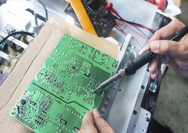 Technician repairing  a television.