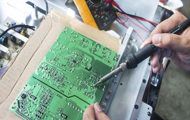 Technician repairing  a television.