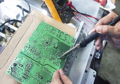 Technician repairing  a television.