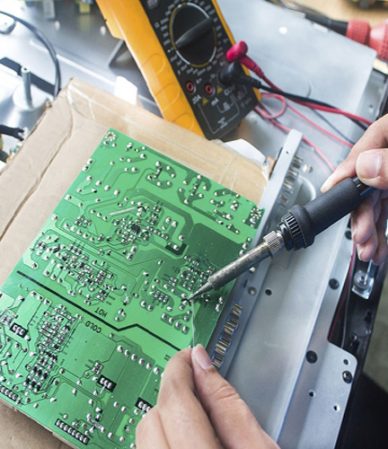 Technician repairing  a television.